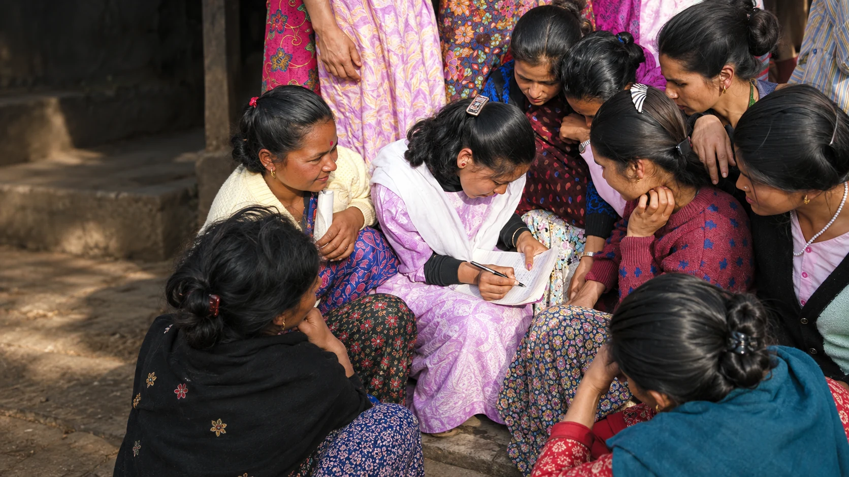 Women collaborating on a community planning activity